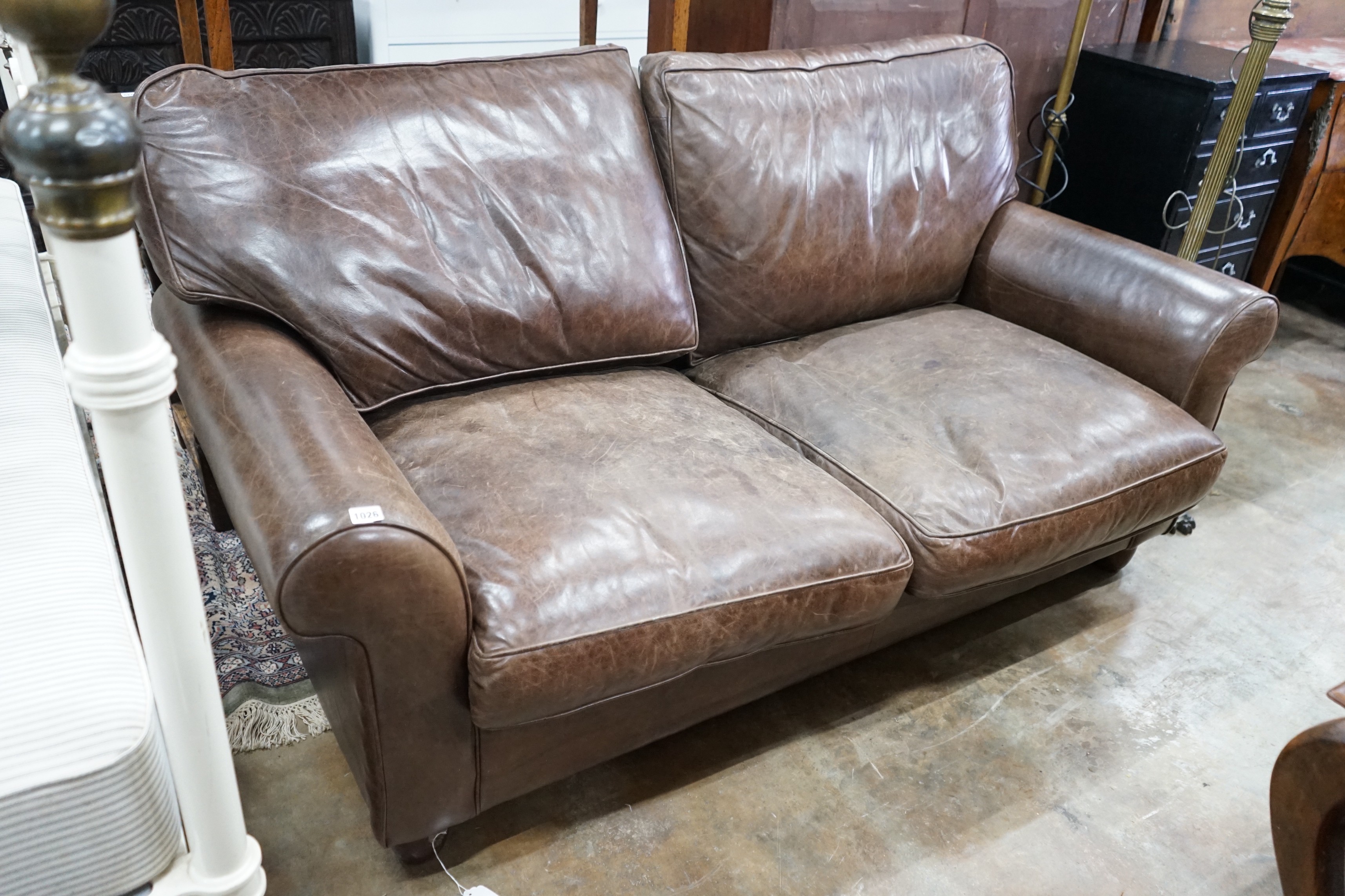 A Laura Ashley brown leather sofa bed, width 170cm, depth 96cm, height 86cm